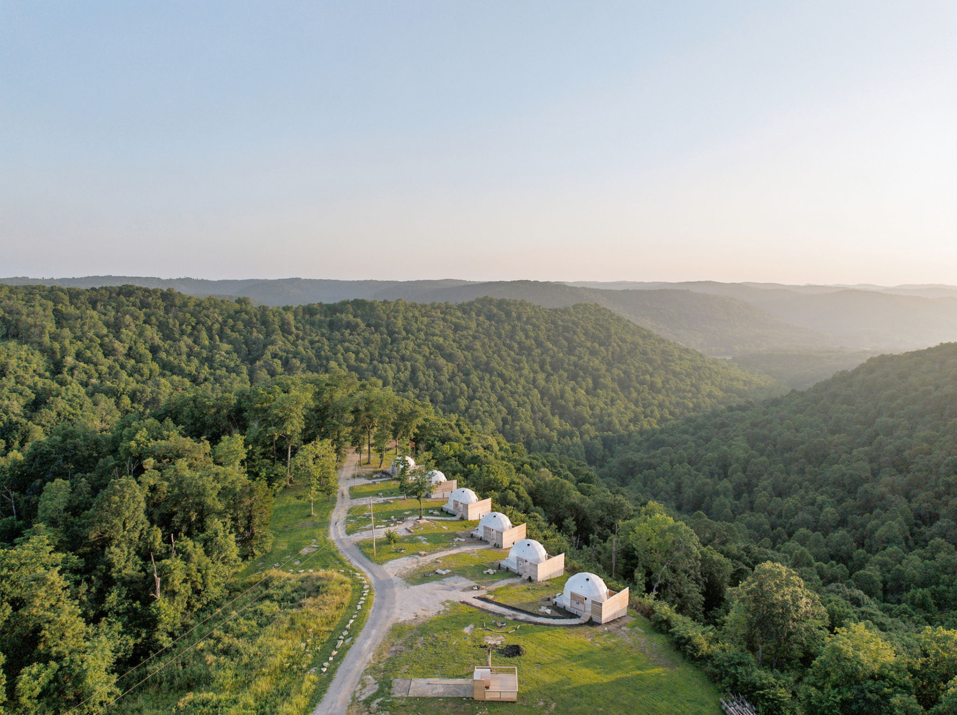 Aerial view of The Overlook RRG domes nestled on a forested ridgetop in the Red River Gorge