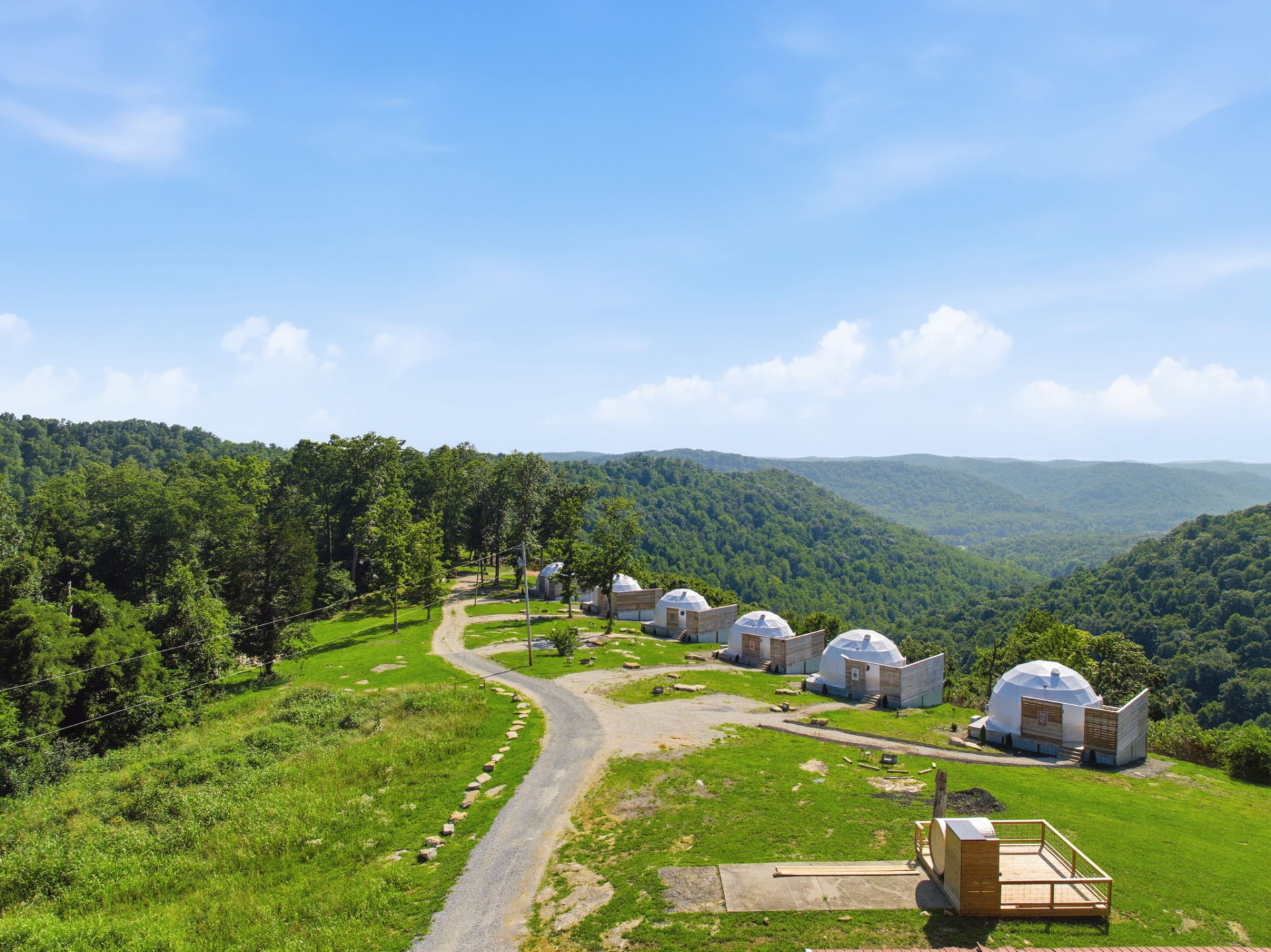 Daytime aerial view of The Overlook domes along the ridgetop above the Red River Gorge valley